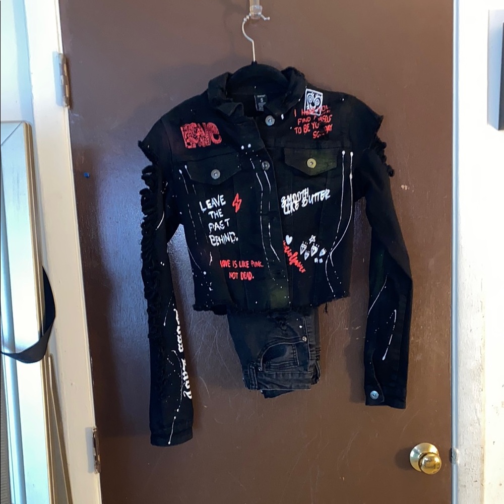 Women’s distressed, black jean jacket
